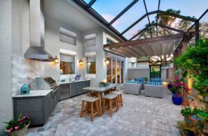 Photo of an upscale outdoor kitchen and living space in Sarasota Florida
