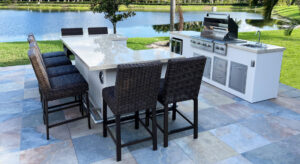 Photo of a custom island table with a grill in an outdoor space in Sarasota Florida 